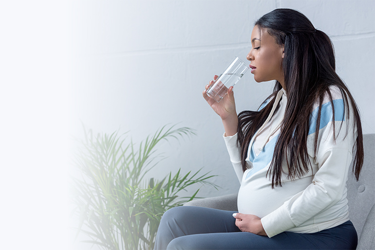 Women Drinking Water After Water Filtration System Purification